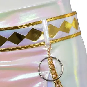 Close-up detail of children iridescent white cos skirt waist with gold diamond belt and metal chain.