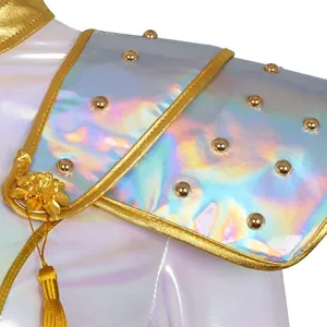 Close-up detail of kids holographic cosplay shoulder armor with golden trim and metallic studs.