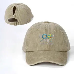 Distressed ponytail baseball cap featuring cool pool hair embroidery and adjustable strap.