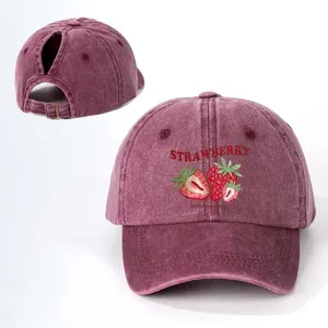 Distressed maroon ponytail baseball cap with cute strawberry print and adjustable back strap.