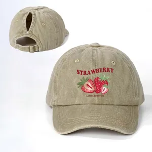 Vintage washed cotton ponytail baseball cap with cute strawberry print and adjustable strap.