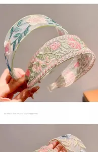 Detailed view of the mesh embroidered flower headband, showing delicate floral lace and wide brim.