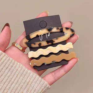 Detailed view of the 3pcs acetate hair clips set featuring stylish tortoiseshell and wavy designs.
