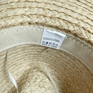 Detailansicht Damen Sommer gewebter Bast Strohhut Innenetikett hochwertige Materialqualität