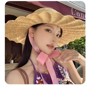 Cappello di paglia a tesa larga da donna, cappello da sole estivo con nastro rosa.