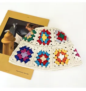 Handmade crochet floral bucket hat, retro color-blocked hollow knit design, cozy daily wear.