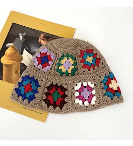 Handmade crochet bucket hat with colorful granny square floral pattern, vintage style chic.