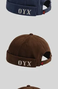 Vue rapprochée détaillée de la casquette docker brodée de style japonais avec le design OYX.