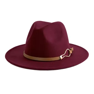 Detail shot of the burgundy fedora hat, featuring a brown leather belt and metal buckle.