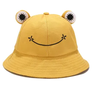 Cute yellow frog bucket hat with embroidered smile. Soft cotton sun hat for casual outdoor wear.