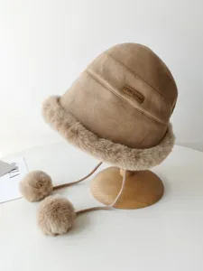 Winter warm suede bucket hat with plush fur trim and cute pom-pom strings for women.