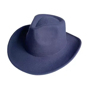 Detail view of a classic navy blue wool felt fedora hat, western cowboy style for autumn winter.