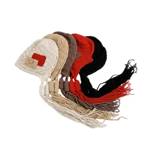 Korean style knitted beanie hat detail showing multiple color options with long tassel braids.