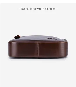 Dark brown leather men vertical crossbody bag bottom detail professional studio closeup view.