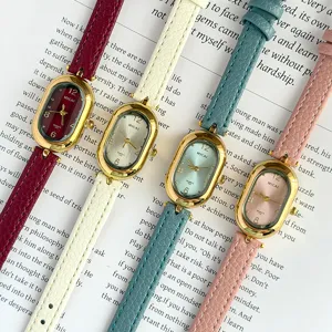 Close-up detail of retro oval leather strap quartz watches in multi colors, vintage style.
