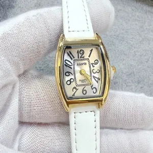 Kloris women tonneau quartz watch with white leather strap and classic dial design detail.