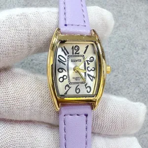 Women's quartz watch with purple leather strap, gold tonneau case and vintage dial.