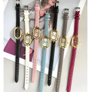 MICAI women leather strap quartz watch, vintage oval dial minimalist fashion accessory detail.