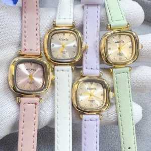 Detail shot of square dial quartz watches with colorful leather straps, metallic case and clear dial.