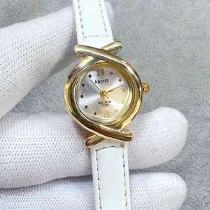 Kloris women quartz watch with white leather strap and unique cross bezel design vintage style.