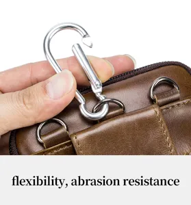 Close-up of genuine leather men waist bag detail featuring metal carabiner and durable stitches.