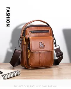 Vintage brown leather messenger bag detail, featuring durable strap and multi-pocket design.