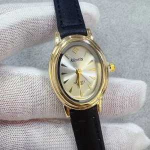 Kloris dames horloge ovaal quartz uurwerk gouden kast zwarte lederen band elegant chic