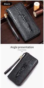 Detail view of genuine leather long zipper wallet with crocodile pattern and convenient wrist strap.