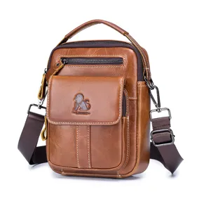Close-up view of brown leather men's cross-body bag featuring front flap pocket and sturdy strap.