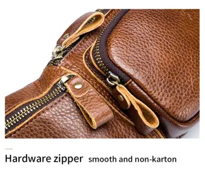 Genuine leather chest bag hardware zipper detail showing vintage brown cowhide quality texture.