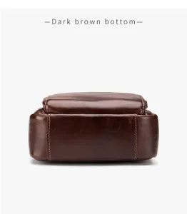 Detail view showing the dark brown bottom of a genuine leather men vintage crossbody bag.