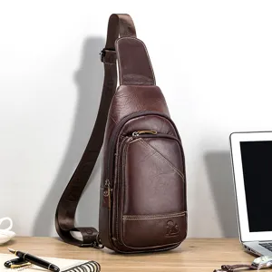 Detail shot of a genuine leather men's chest sling bag in dark brown with multiple zipper compartments.