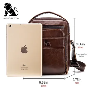 Vintage leather men's shoulder bag, small vertical crossbody bag with front pocket and durable strap.
