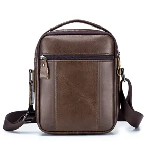 Detailed view of brown genuine leather men messenger bag with top handle and zipper pocket.