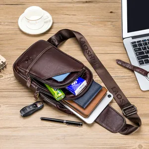 Detailed view of genuine leather chest bag with multiple zipper compartments, showing large capacity.