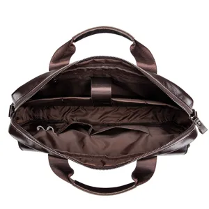 Detailed view of the brown leather briefcase interior, showing multiple compartments and slots.
