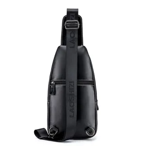 Black leather chest bag detail, men's sling shoulder bag with adjustable strap and metal zippers.