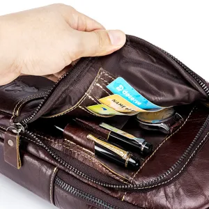 Genuine leather chest bag detail view, multi-pocket design with pen holder and card slots for men.