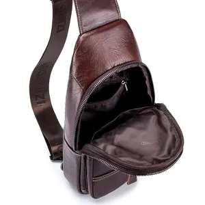 Detail view of the brown leather men sling bag, showing cowhide texture and inner pocket structure.