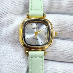 Kloris women's quartz watch with mint green leather strap and gold square dial vintage style.