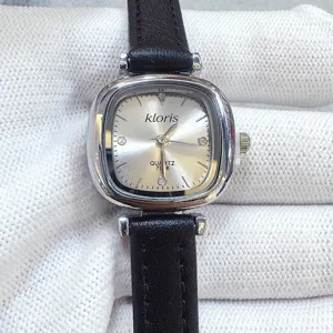 Kloris minimalist women quartz watch with small square dial and black leather strap.