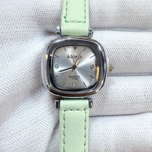 Minimalist square dial quartz watch with light green leather strap, elegant daily wear accessory.