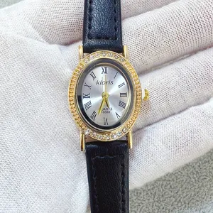 Kloris women's quartz watch featuring an elegant oval rhinestone dial and black leather strap.