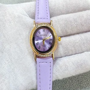 Purple leather strap quartz watch with oval rhinestone bezel and classic Roman numerals.