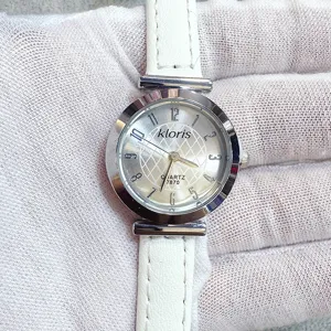 Kloris women quartz watch with white leather strap and silver dial detailed closeup view.