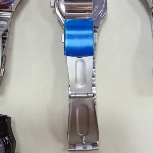 Detailed shot of men watch stainless steel strap and folding clasp with protective film.