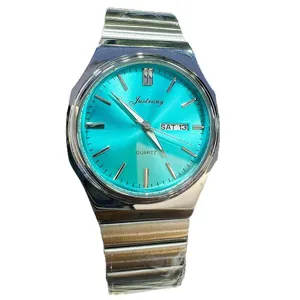Men's quartz watch with turquoise dial stainless steel integrated strap and calendar display.