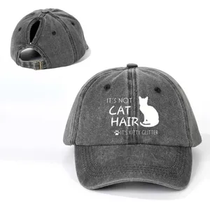 Detail shot of distressed washed cotton baseball cap with ponytail hole and funny cat print.