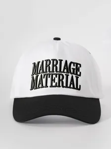 Close-up detail of embroidered text on a stylish black and white two-tone baseball cap.