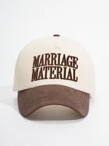 Detailed view of the stylish color-blocked baseball cap featuring elegant brown embroidery.